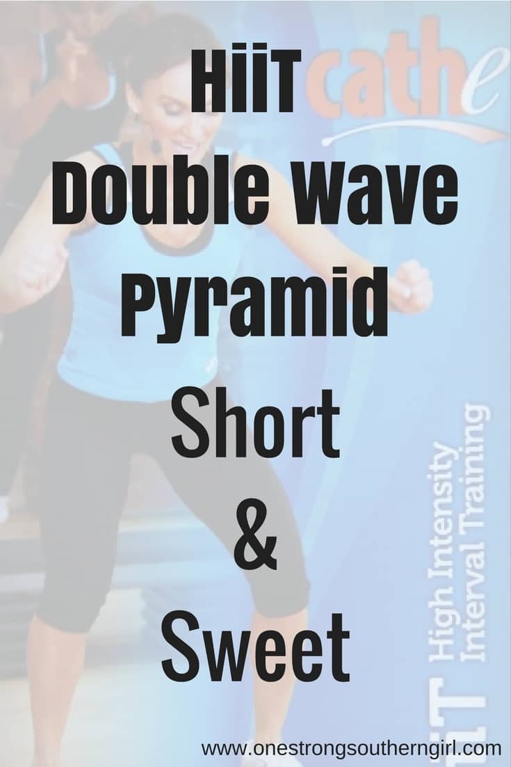 Cathe Friedrich jumping onto an aerobic step in the Double Wave Pyramid workout series