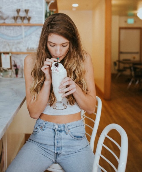 girl drinking a milkshake